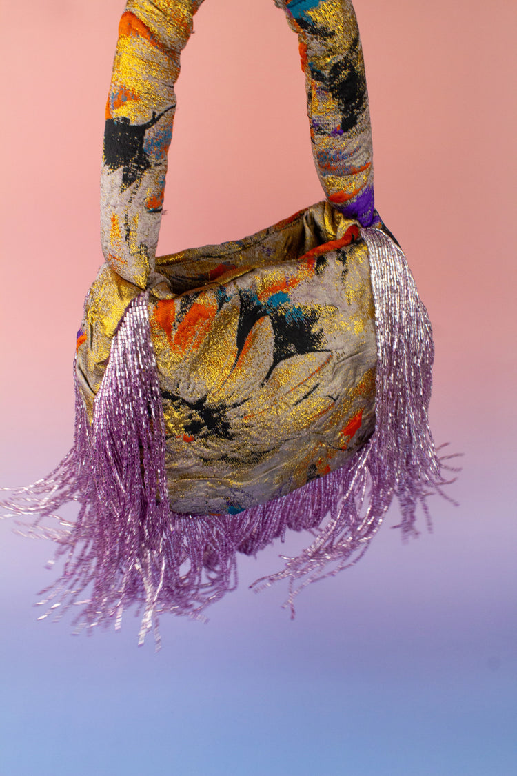 Bolso soleil flecos malva